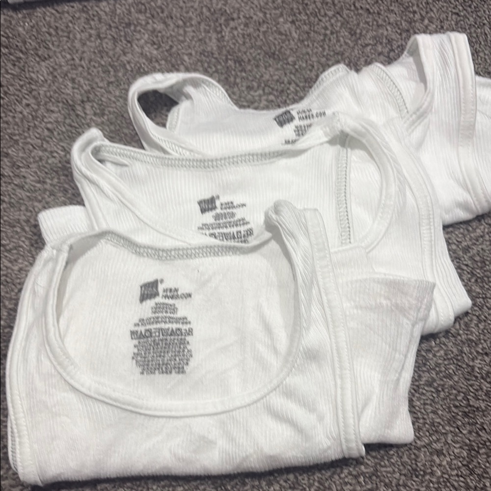 Boys size medium White Tank Tops- used in great condition 3 pairs for 12 dollars